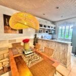 Open-plan space for family meals and gatherings in Villa Carissa