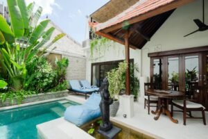 Outdoor dining area with pool view Villa Carissa